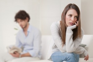 Woman not happy with man on couch