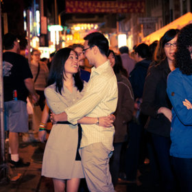 Couple holding each other in Chinatown