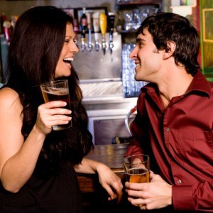 Couple enjoying drinks at a bar