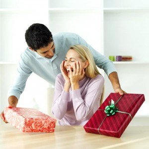 Woman receiving gifts from a man