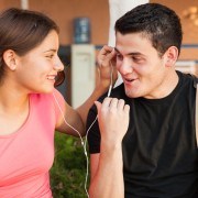 guy and girl listen to music together