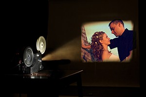Film projector projecting a couple in love.