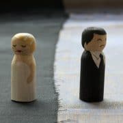 toy couple in sad marriage
