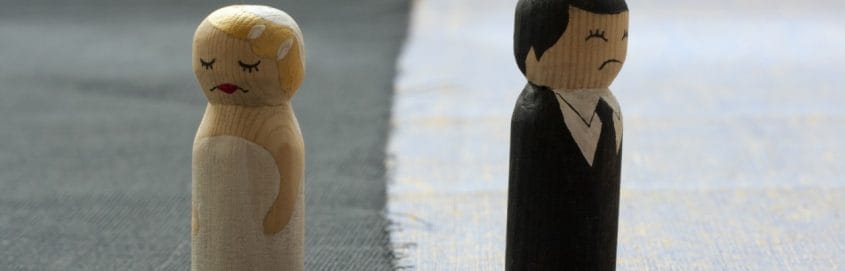 toy couple in sad marriage