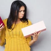 unhappy woman holding box